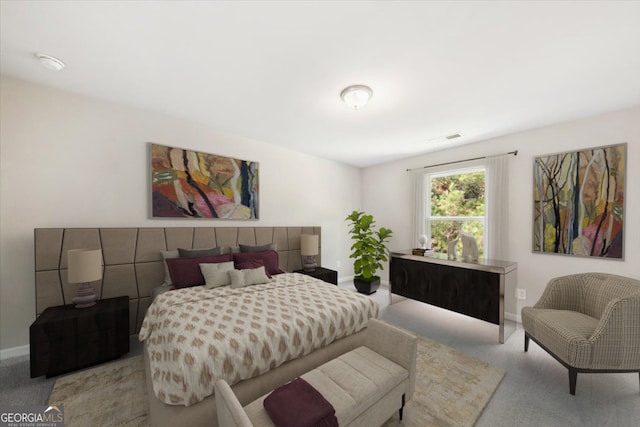 bedroom featuring light colored carpet