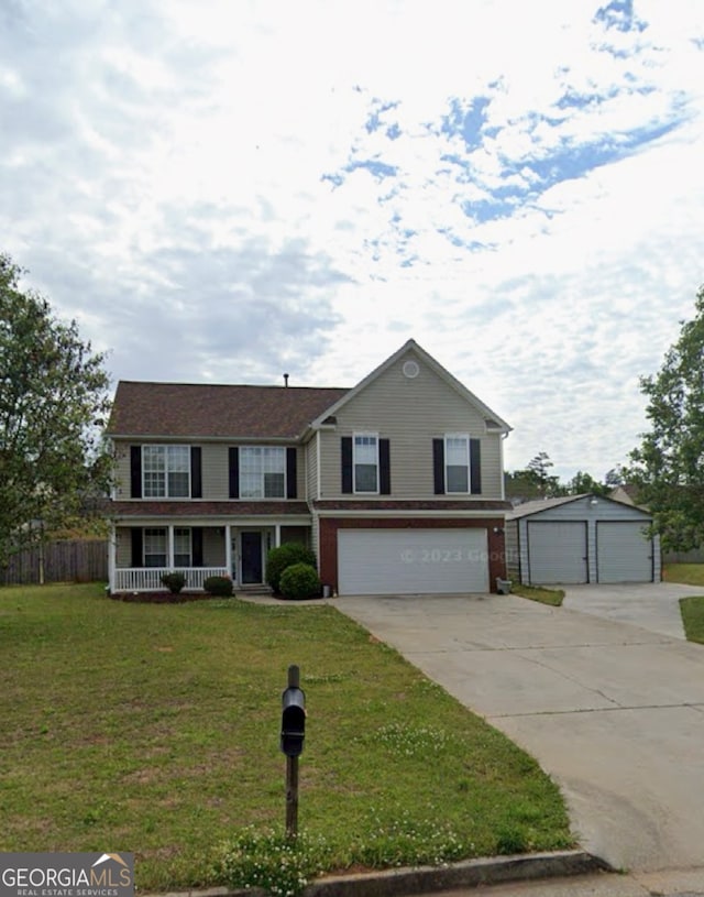 view of front of property with a front yard, a porch, and a garage