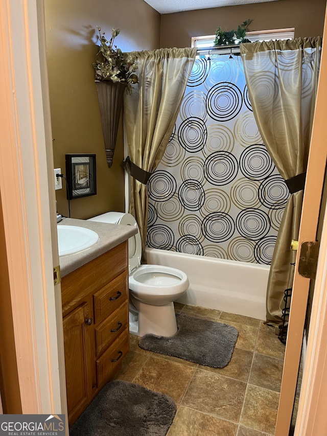 full bathroom with vanity, toilet, and shower / bath combination with curtain