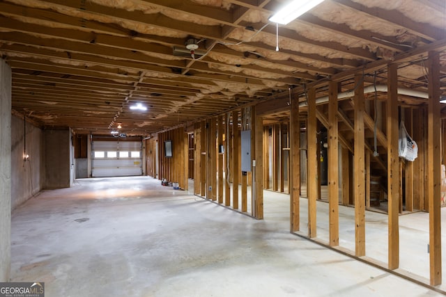 miscellaneous room featuring concrete flooring and electric panel