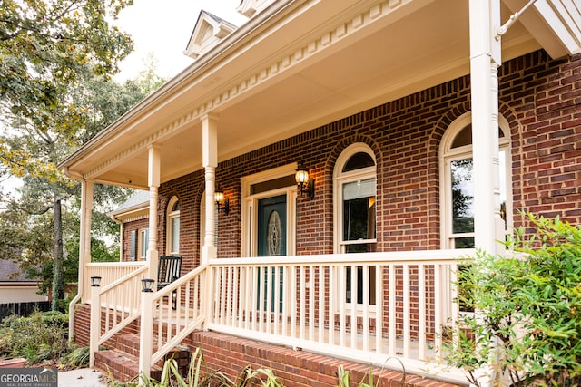 property entrance featuring covered porch