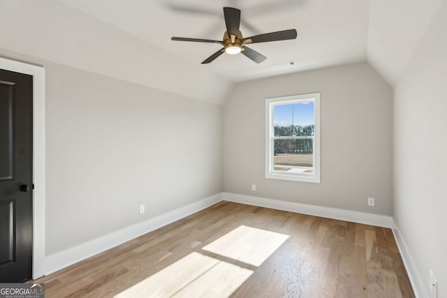 additional living space with lofted ceiling, light hardwood / wood-style floors, and ceiling fan