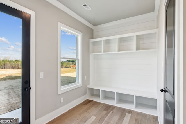 mudroom with light hardwood / wood-style floors