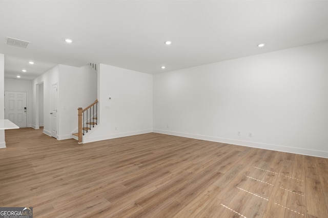 spare room with light hardwood / wood-style flooring