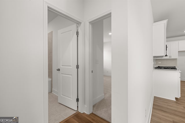 corridor featuring light hardwood / wood-style flooring