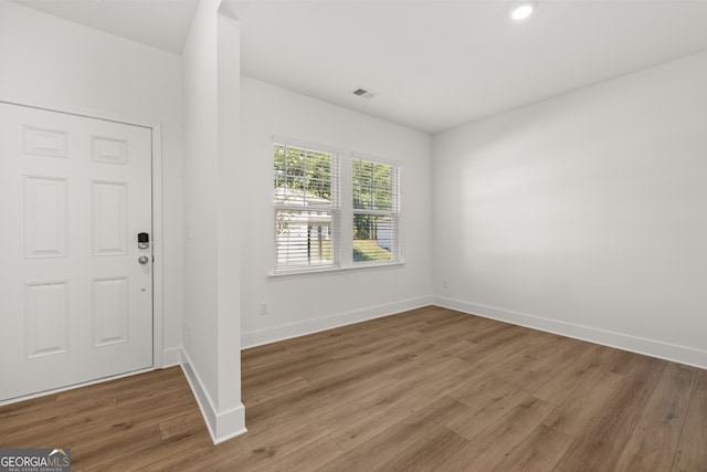 entryway with hardwood / wood-style floors