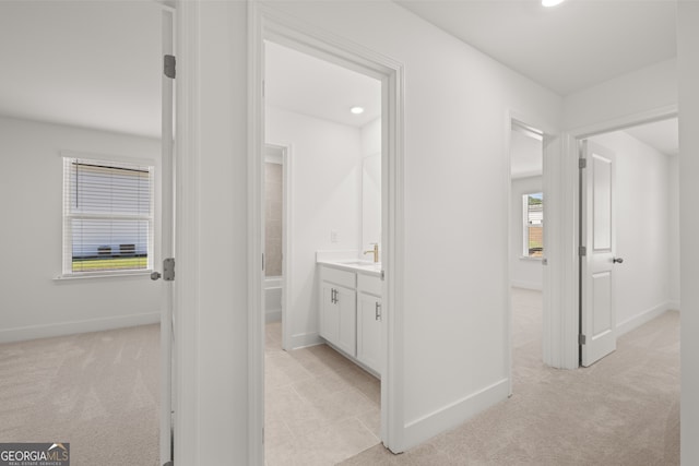 bathroom with vanity and a shower