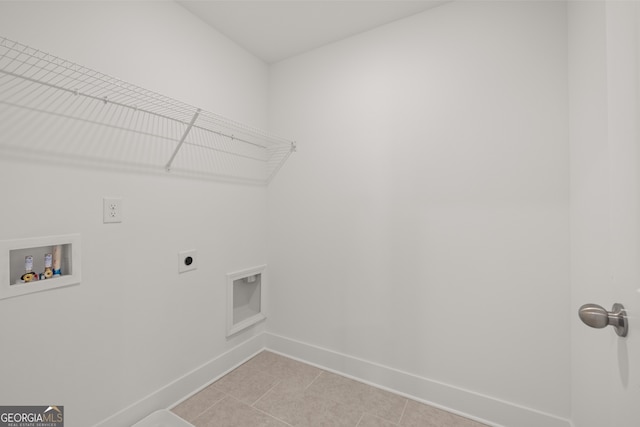 laundry area with light tile patterned flooring, hookup for an electric dryer, and washer hookup