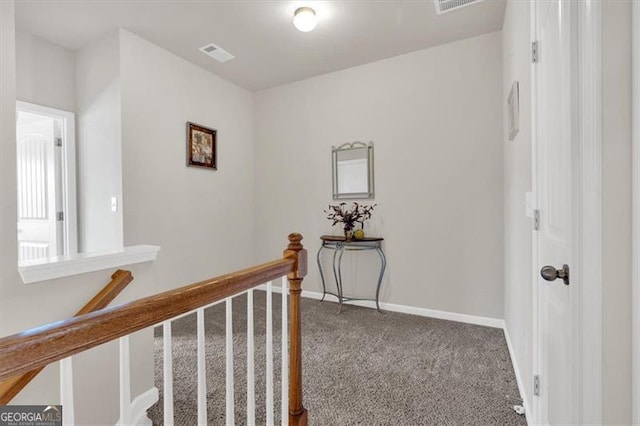 hallway with carpet floors