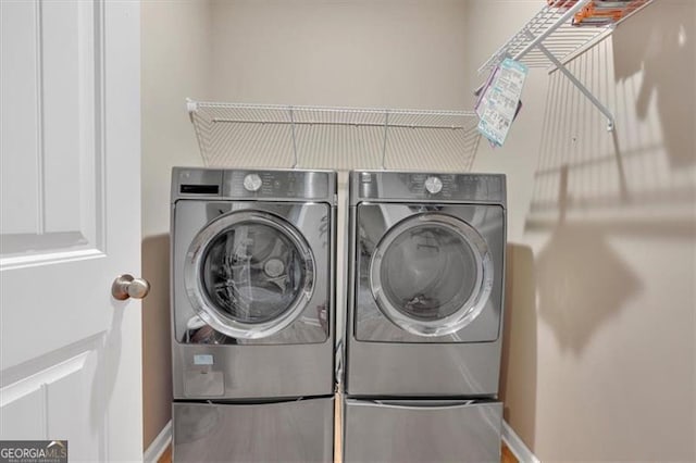 laundry area with washer and dryer