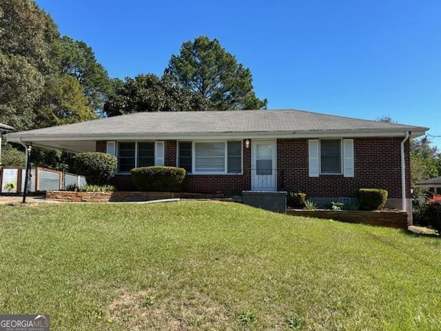 2704 Gresham Rd SE, Atlanta, GA 30316 - ranch-style house with an attached carport, brick siding, and a front yard