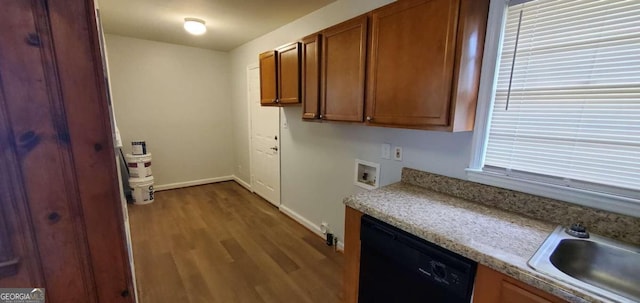 2704 Gresham Rd SE, Atlanta, GA 30316 - kitchen featuring brown cabinetry, wood finished floors, baseboards, black dishwasher, and light countertops