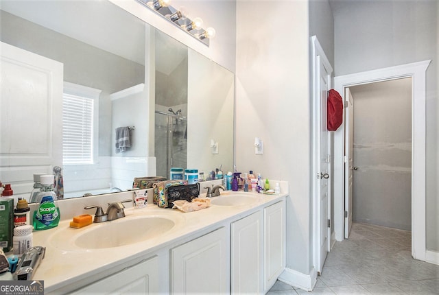 421 Bedford Xing, Mcdonough, GA 30253 - bathroom with double vanity, a shower stall, tile patterned floors, and a garden tub