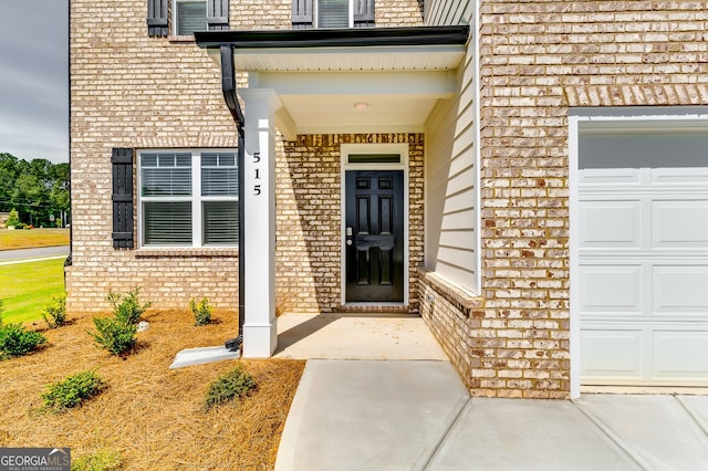 doorway to property featuring a garage