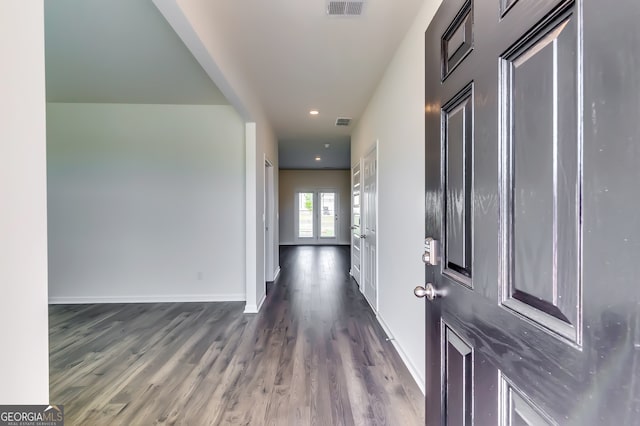 entryway with french doors and dark wood-type flooring