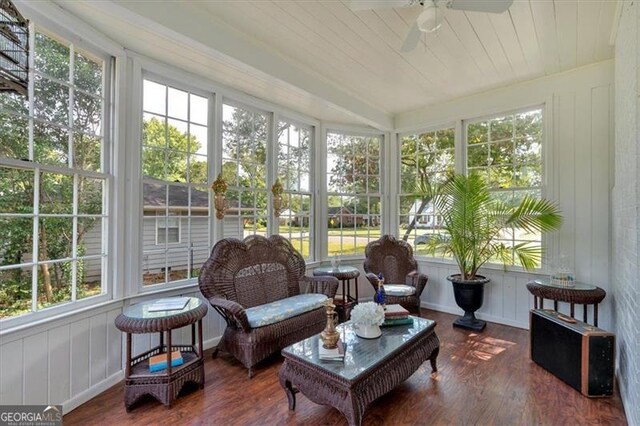 sunroom / solarium featuring ceiling fan and wooden ceiling