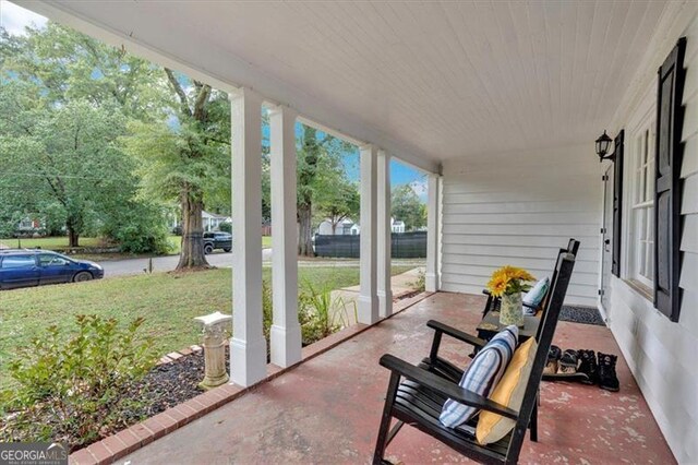 doorway to property featuring a porch