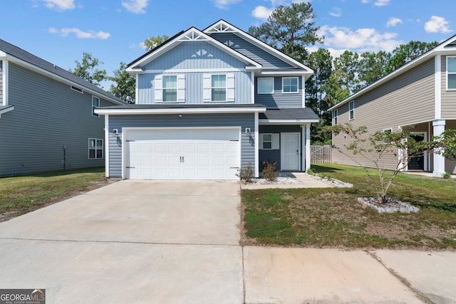 view of front facade with a front yard and a garage