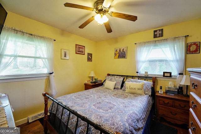 bedroom featuring ceiling fan and dark wood-type flooring