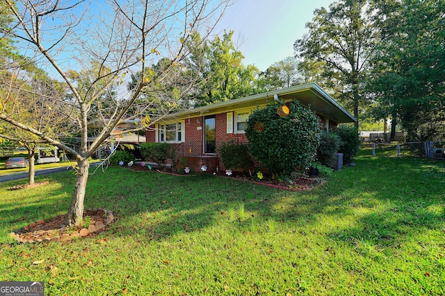 view of side of home with a lawn