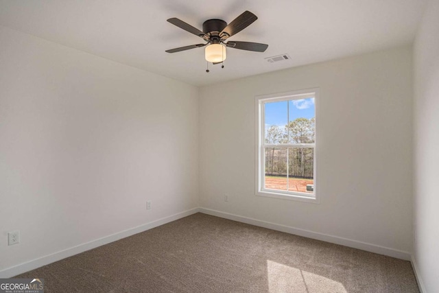 carpeted empty room with ceiling fan