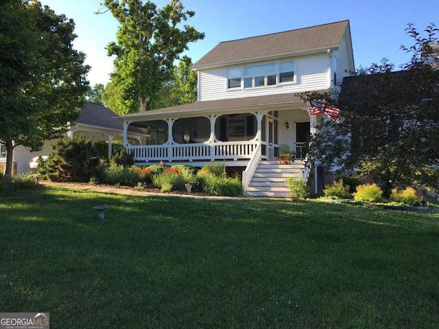 view of front of home with covered porch and a front lawn