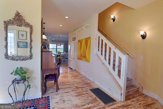 carpeted bedroom with ceiling fan and two closets