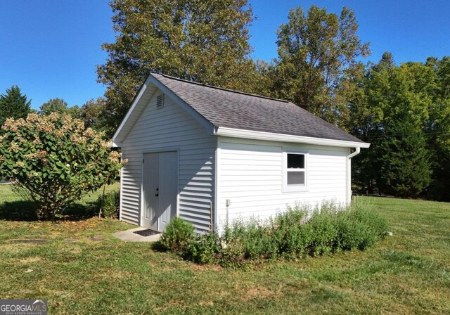 garage featuring a yard