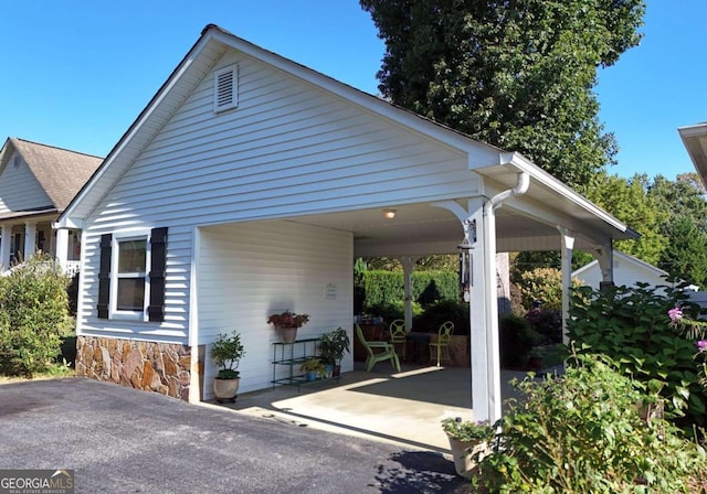 view of front of property with a carport