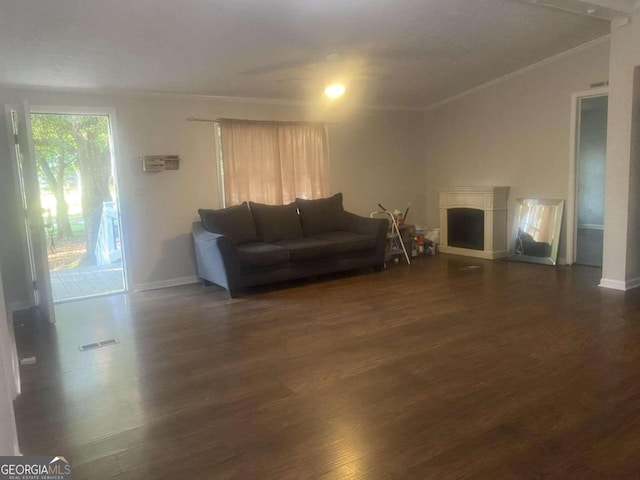 living room with ornamental molding and dark hardwood / wood-style flooring