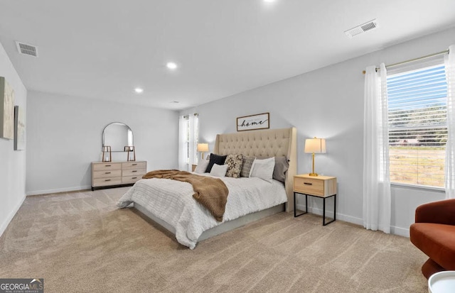 bedroom with carpet floors, recessed lighting, and visible vents