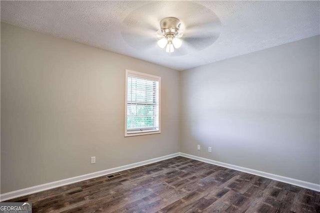 unfurnished room featuring dark hardwood / wood-style floors, a textured ceiling, and ceiling fan