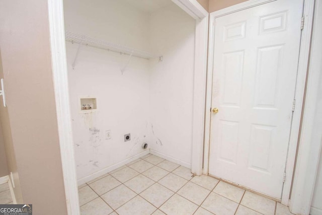 laundry area with hookup for a washing machine, light tile patterned flooring, and electric dryer hookup