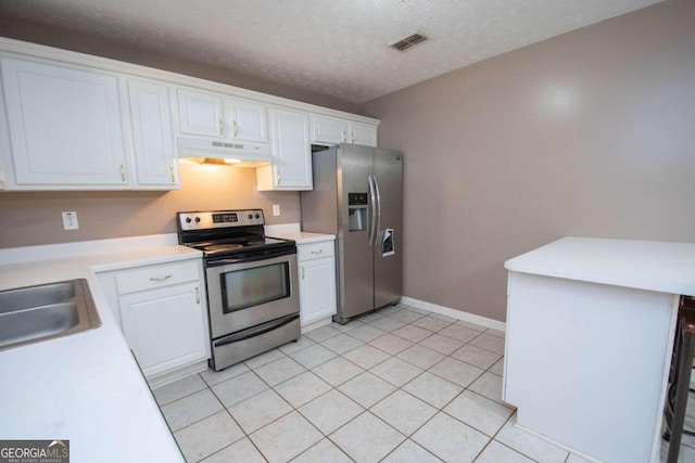 kitchen featuring a textured ceiling, appliances with stainless steel finishes, sink, and white cabinetry