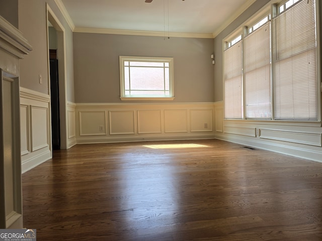 unfurnished room with ceiling fan, dark hardwood / wood-style floors, and crown molding