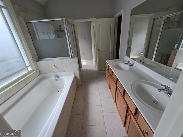 bathroom featuring shower with separate bathtub, tile patterned floors, and vanity