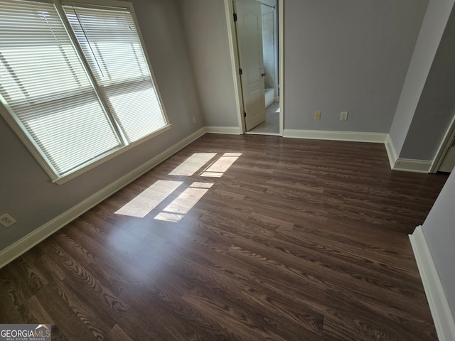 empty room featuring dark hardwood / wood-style floors