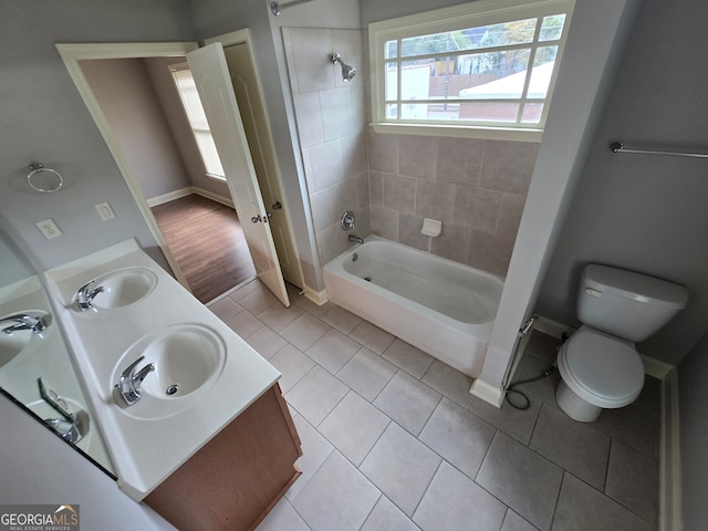 bathroom with vanity, toilet, and tile patterned floors