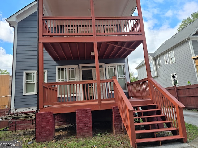 back of house with a wooden deck