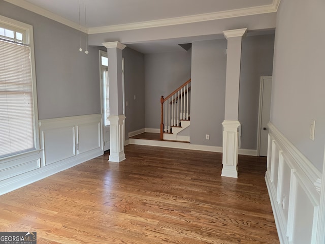 interior space with crown molding and hardwood / wood-style floors