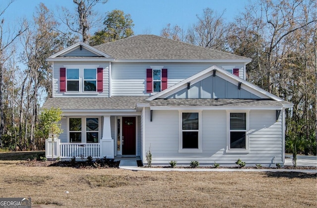 view of front facade featuring a front yard and a porch