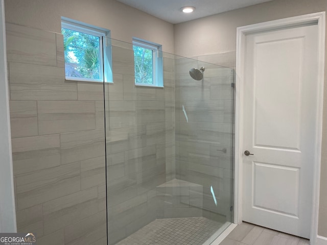 bathroom with a tile shower