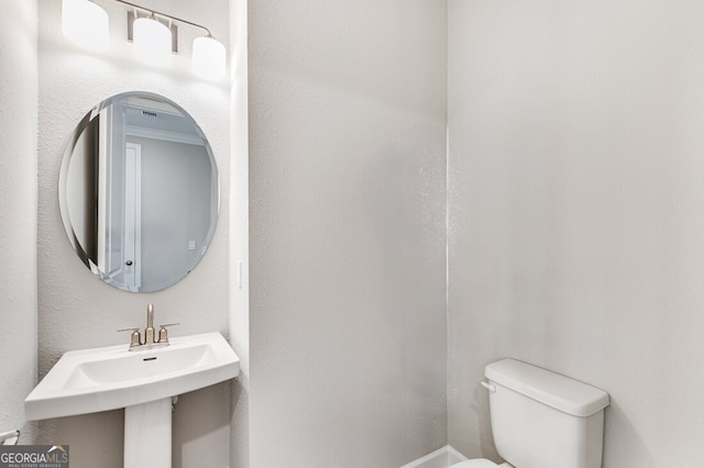 bathroom featuring sink and toilet