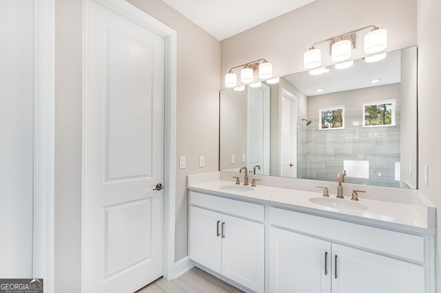 bathroom featuring a tile shower and crown molding