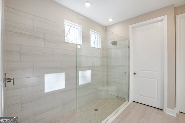 bathroom with a tile shower