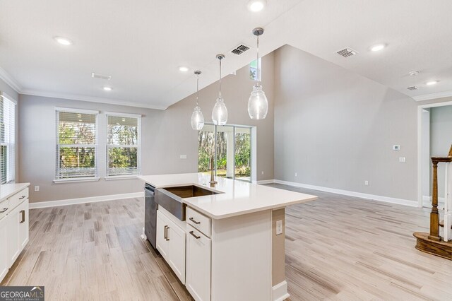 unfurnished living room featuring plenty of natural light, a high ceiling, and hardwood / wood-style flooring