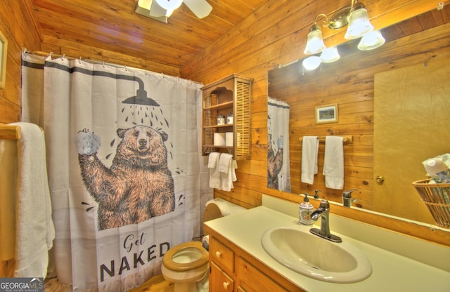 bathroom with vanity, ceiling fan, wood walls, and wood ceiling