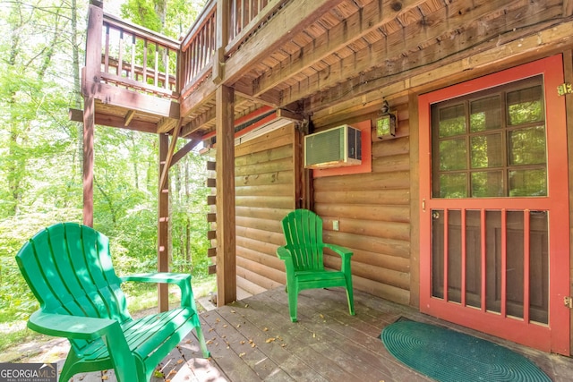 view of patio with a deck and an AC wall unit