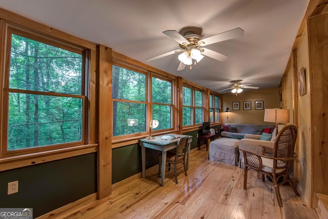 sunroom / solarium with ceiling fan