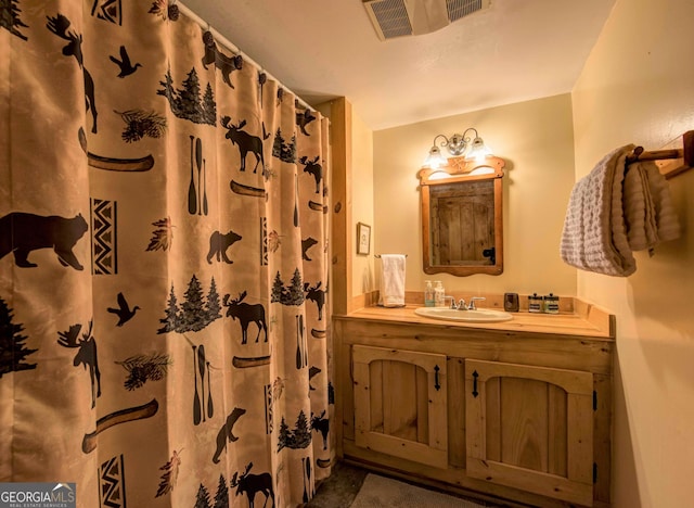 bathroom with vanity and walk in shower